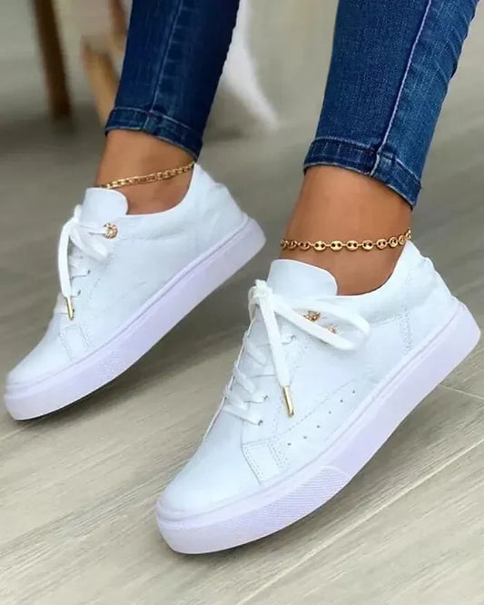 Chic sneakers with gold detail