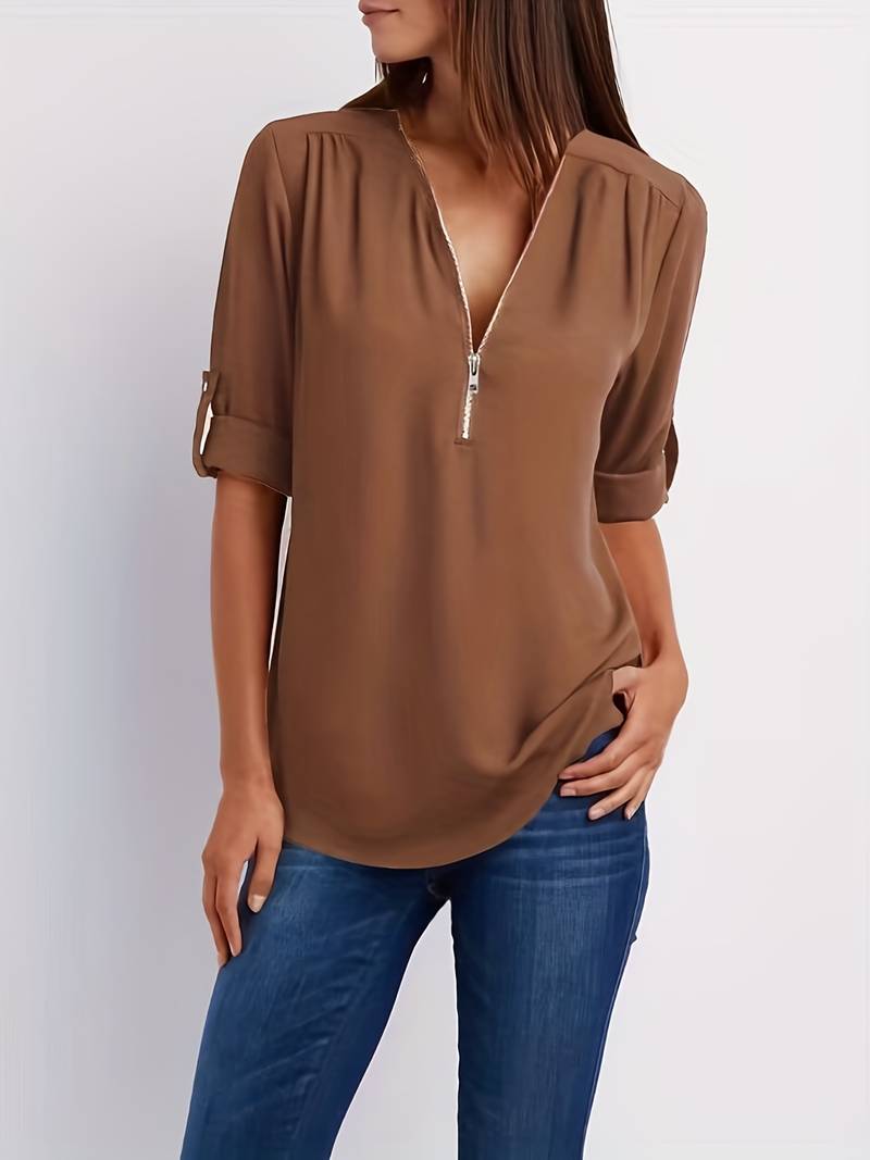 Hazel – casual, ruffled blouse with roll-up sleeves and half zip