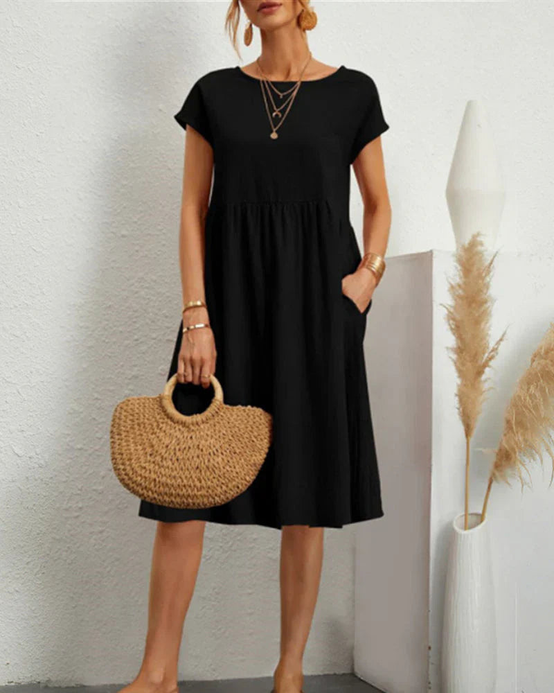 Comfortable midi dress with a round neckline and pockets